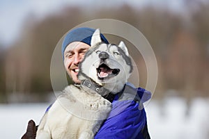 Happy man with a husky