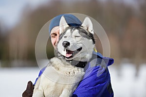 Happy man with a husky