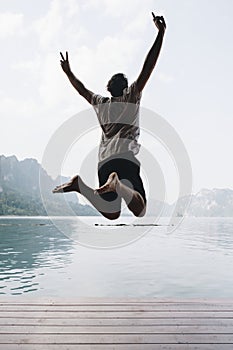 Happy man jumping with joy
