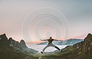 Happy man jumping in mountains vacations outdoor