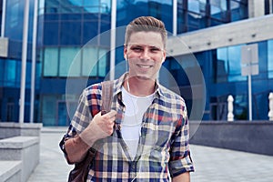 Happy man listening to music in front of business canter