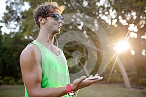 Happy man listening to music on mobile phone