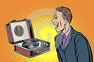 Happy man listening to music. retro vinyl record player