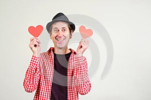 Happy man in love. Happy Valentines Day. Romantic guy holds valentine cards. Be my valentine. Boyfriend showing love fun affection