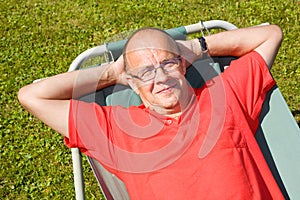 Happy man lying on hammock