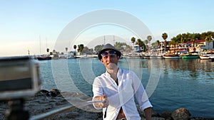 Happy man makes a selfie in front of the marine bay, Side, Turkey