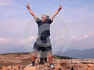 Happy man in the mountain top