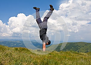 Happy man in mountains