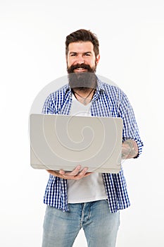 Happy man with notebook. Searching for new job. Bearded man using notebook. Bearded happy man surfing inet on notebook