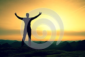 Happy man with open raised arms Gesture of triumph. Satisfy hiker silhouette