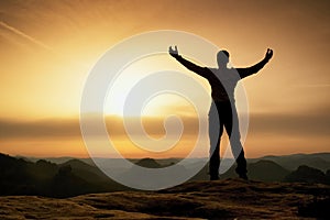 Happy man with open raised arms Gesture of triumph. Satisfy hiker silhouette