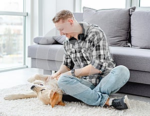 Happy man palming lovely dog