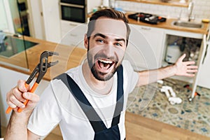 Happy man plumber work in uniform