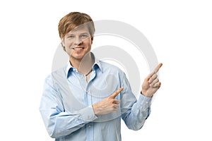 Happy man pointing to blank space photo