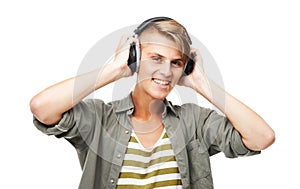 Happy man, portrait and DJ with headphones or audio waves listening to music against a studio background. Male person or