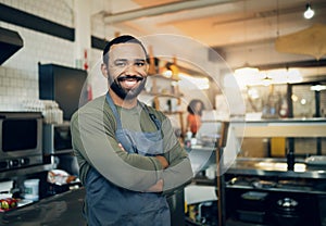 Happy man, portrait and small business owner in kitchen at restaurant for hospitality service, cooking or food. Face of