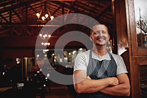 Happy man, portrait and small business owner of restaurant, cafe or pub with a smile for career pride. Male entrepreneur