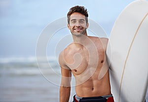 Happy man, portrait and surfboard on beach for waves, exercise or fitness in outdoor hobby, surfing or practice. Active