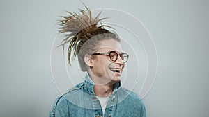 Happy man posing on grey background. Closeup stylish guy laughing at camera