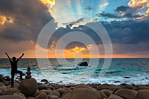 Happy Man Praising or Worshiping at Amazing Sunrise