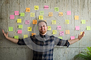 Happy man present his sticky notes chart