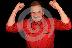 Happy man raising arms