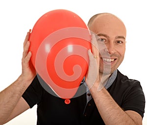 Happy man with red balloon