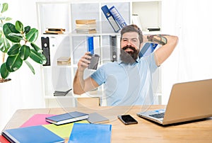 Happy man relaxing in office during coffee break, relaxation