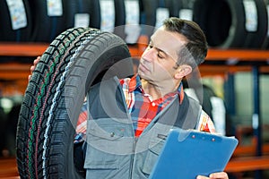 Happy man rolling wheel outdoors