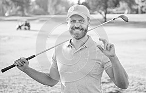 happy man showing ball of golf game on green grass, golf