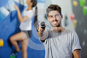 happy man showing stopwatch