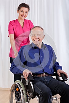 Happy man sitting on wheelchair