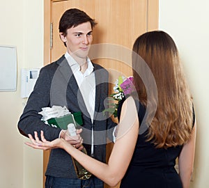 Happy man smiling and give bunch of flowers