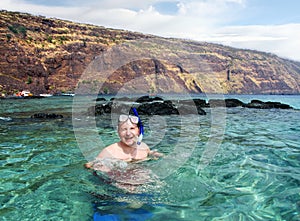 Happy man snorkeling