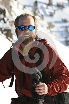 Happy man in snowy mountains