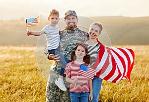 Happy man soldier reunited with his patriotic american family