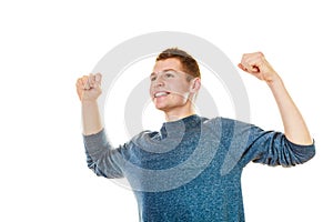 Happy man successful lad with arms up