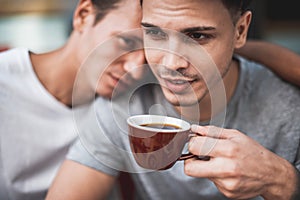 Happy man taking with outgoing friend outside