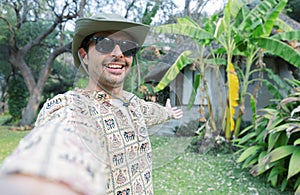 happy man taking selfie photo during summer tropical vacation - Vacation and tourism concept