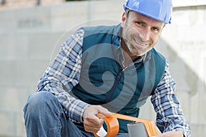 happy man with tape measure