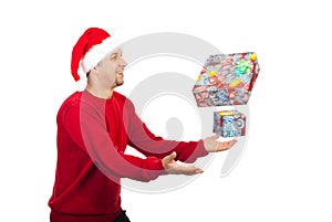 Happy man trying to catch Christmas gifts