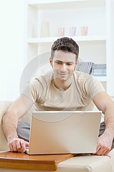 Happy man using computer