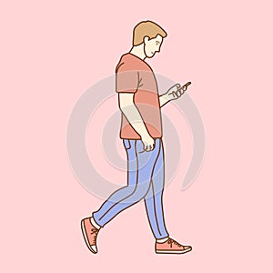 Happy man using phone while walking on street. Concept of young people working mobile devices.