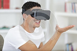 happy man using virtual reality mask