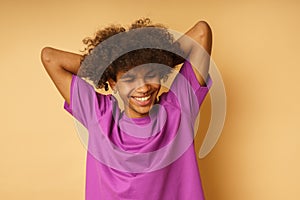 Happy man with violet t-shirt is happy and thoughtless