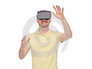 Happy man in virtual reality headset or 3d glasses
