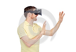 Happy man in virtual reality headset or 3d glasses