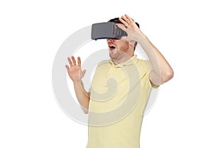 Happy man in virtual reality headset or 3d glasses