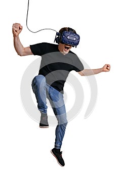 Happy man in VR glasses is screaming and making winner gesture