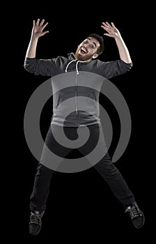 Happy Man in Wacky Pose on Black Background